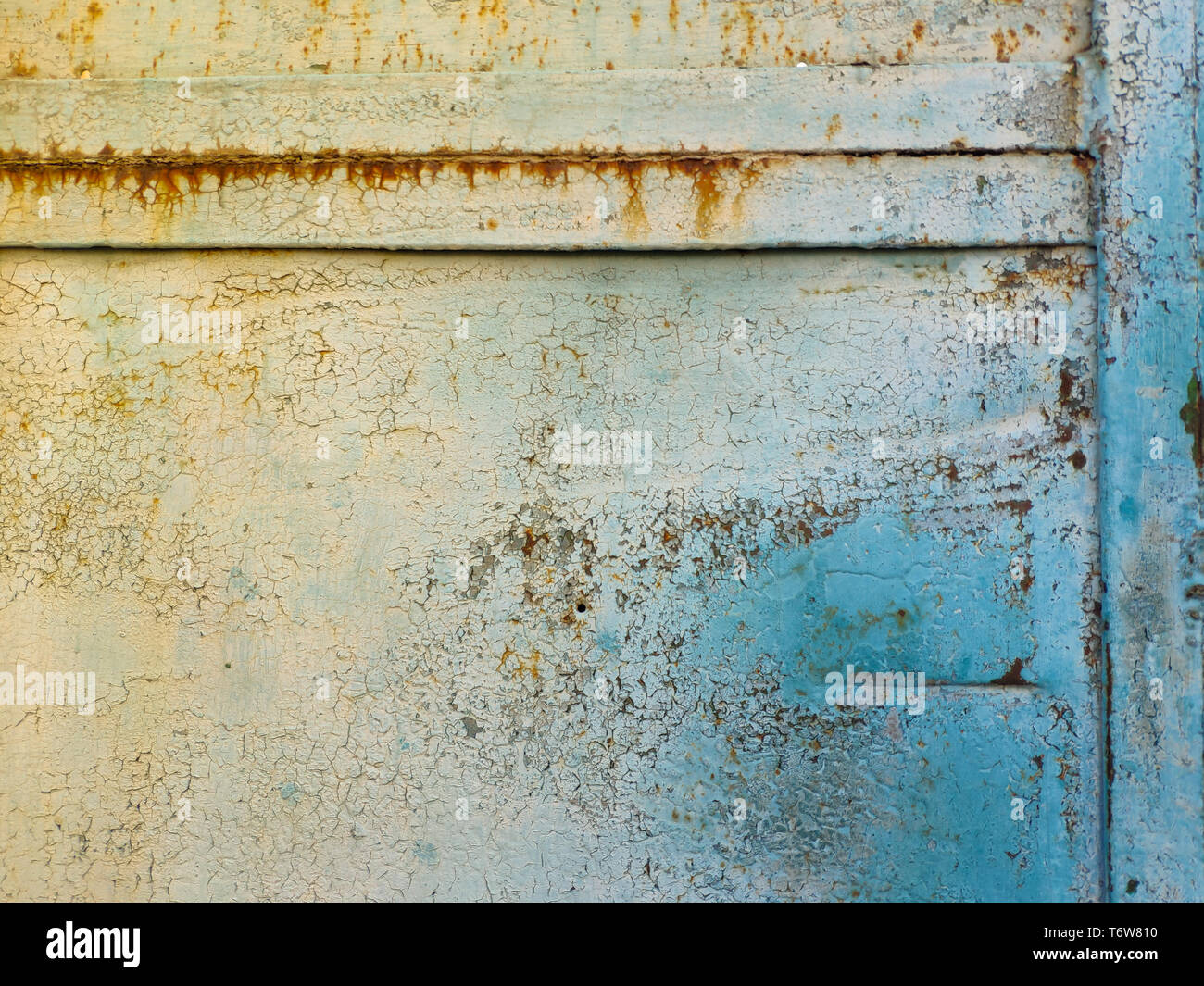 Old torn metal gates, paint peeled off from metal, background or