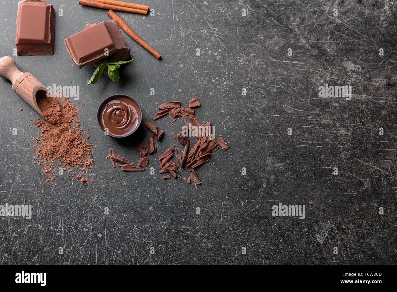 Composition with tasty melted chocolate on grey background Stock Photo