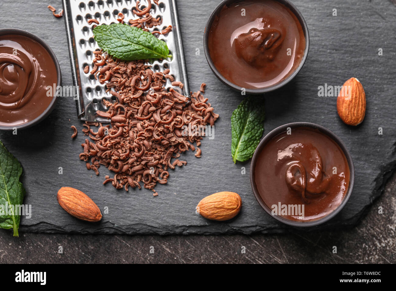 Composition with tasty melted chocolate on table Stock Photo