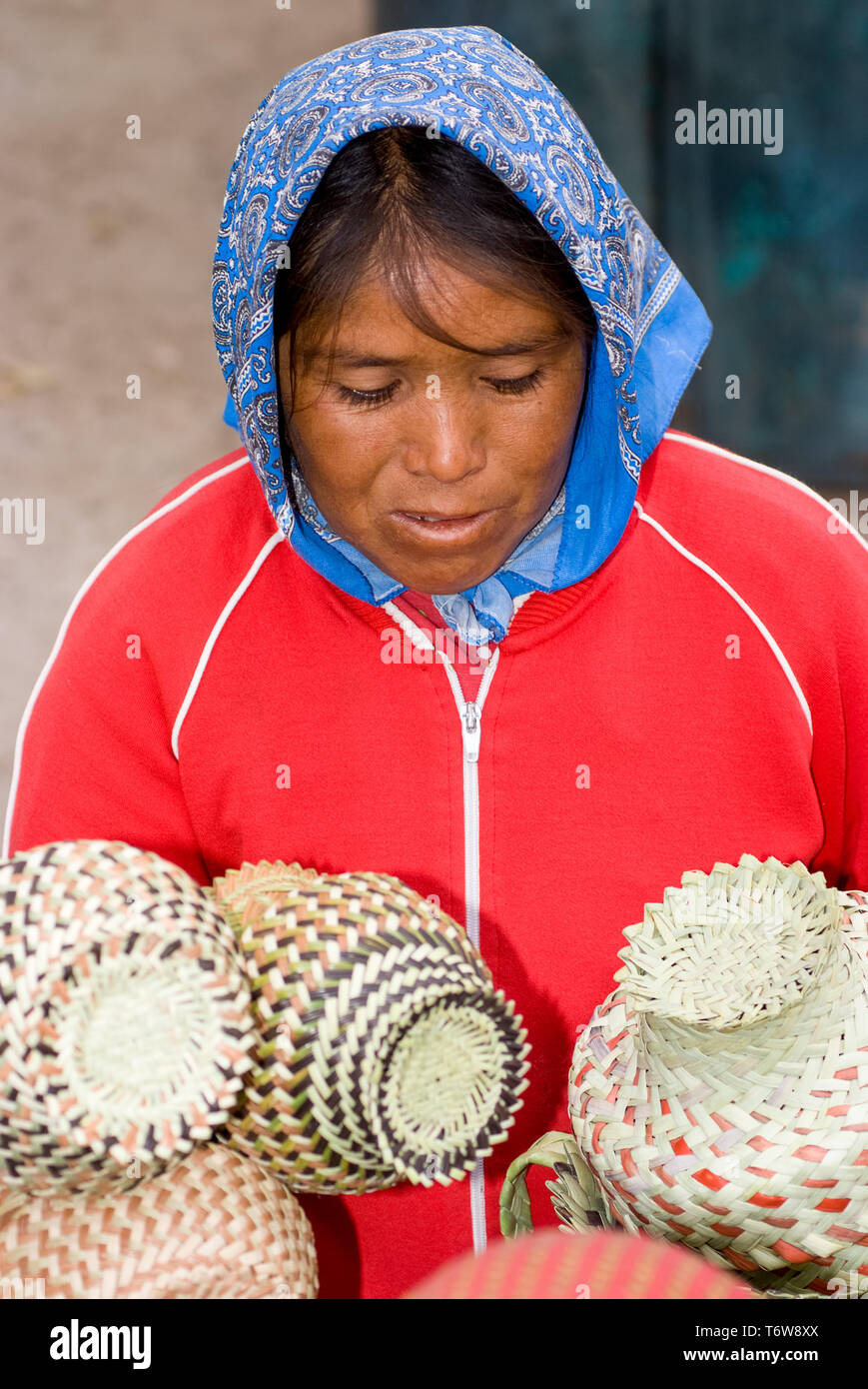 Tarahumara Indian woman selling handwoven baskets and other handicrafts