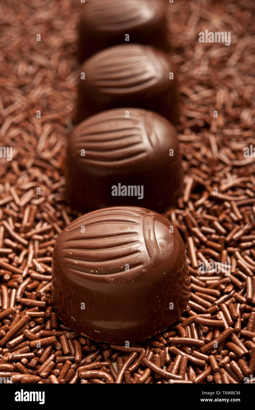 row of chocolate bonbons or pralines Stock Photo
