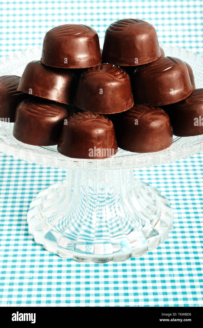 chocolate pralines on a glass stand Stock Photo