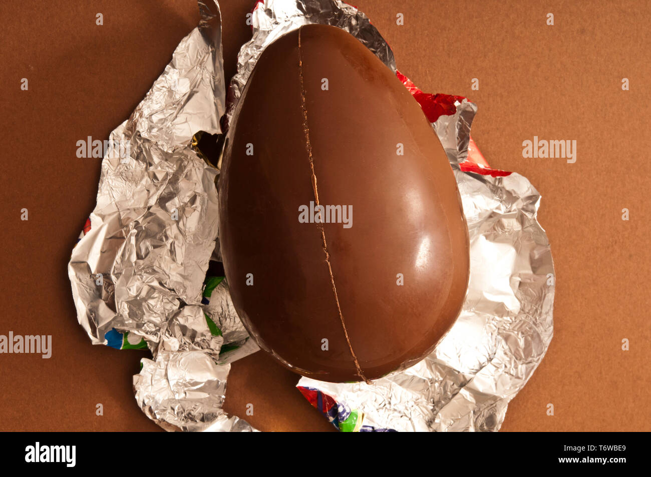 Easter traditional chocolate egg unwrapped Stock Photo