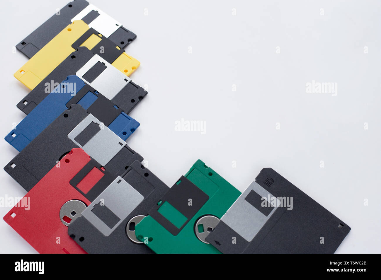 Lot of multi-coloured flexible disks isolated on a white background. Retro style. Stock Photo