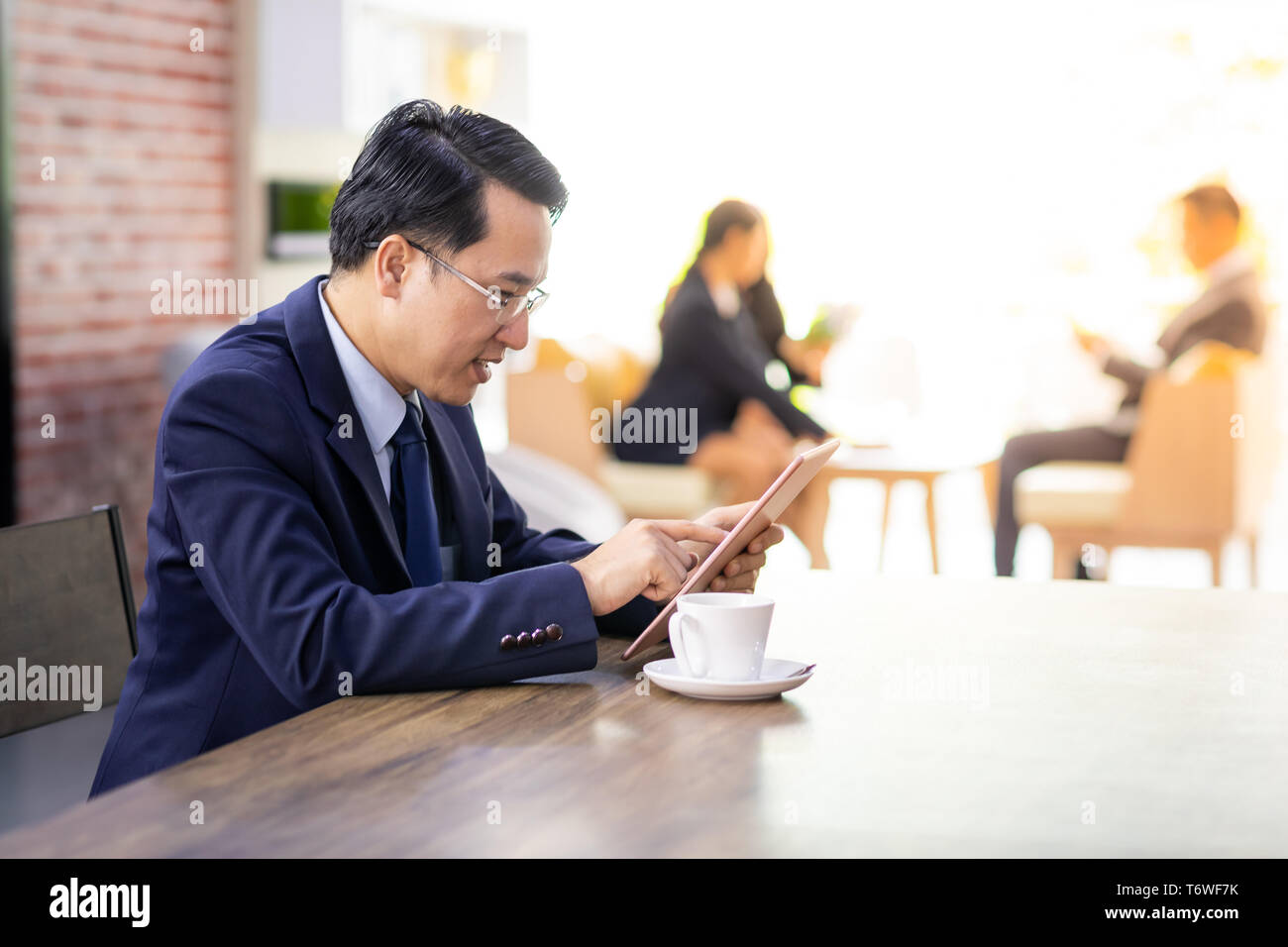 Businessman working in cafe Stock Photo
