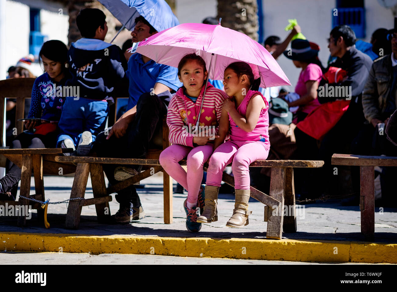 Girls in pink at Festival of the Virgin of Carmen in Paucartambo, Cusco Region, Peru Stock Photo