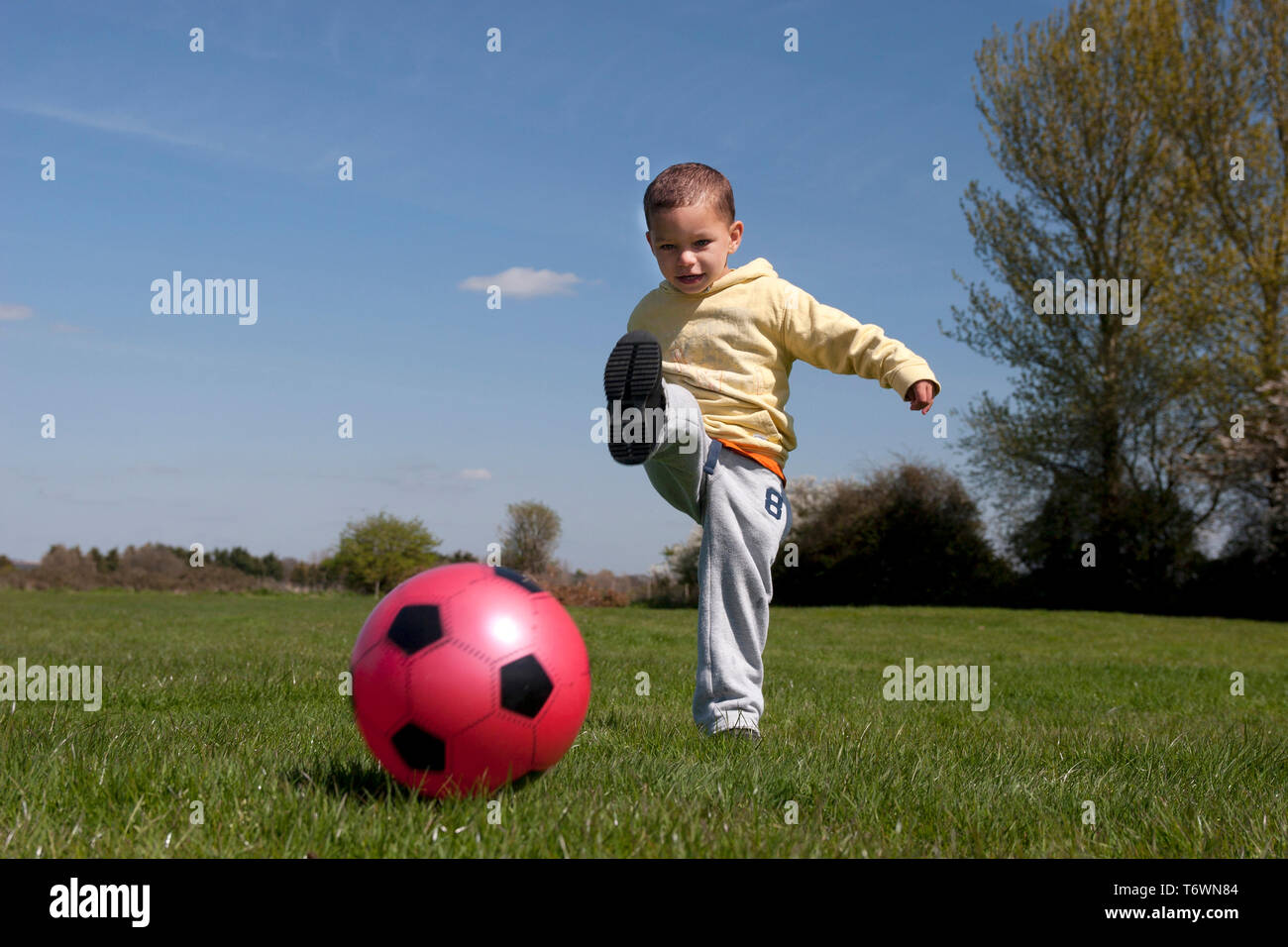 toddler kicking ball