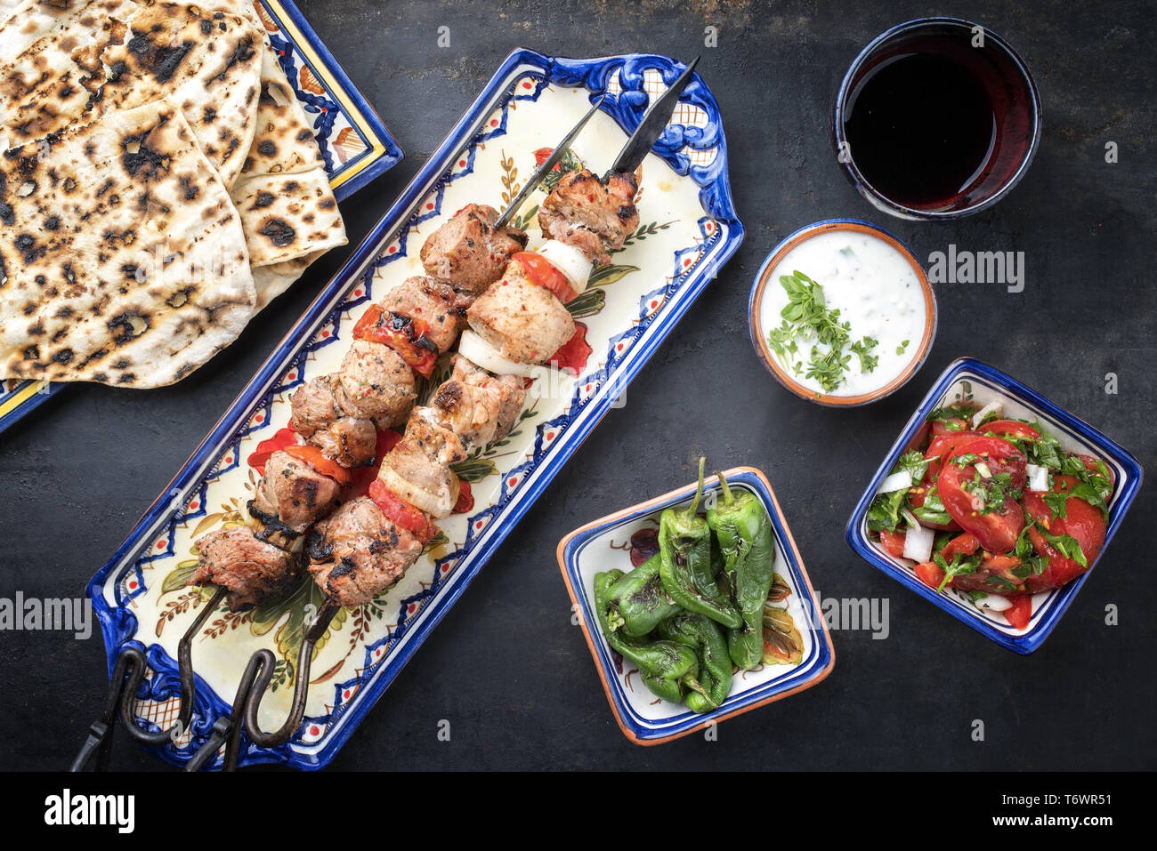 Traditional Greek souvlaki barbecue skewer with flatbread Stock Photo