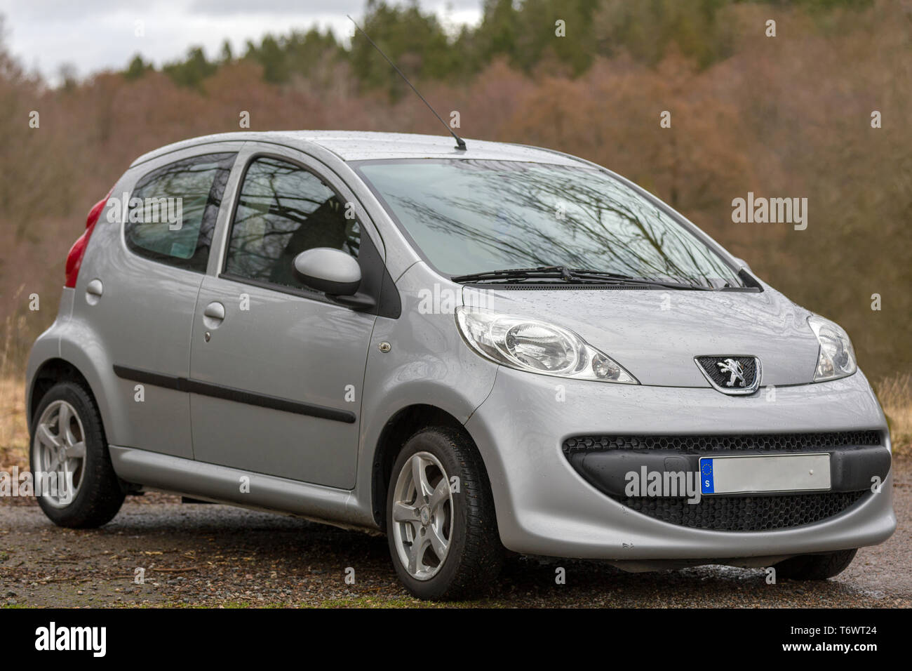 Silver Peugeot 107 city car in countryside setting Stock Photo