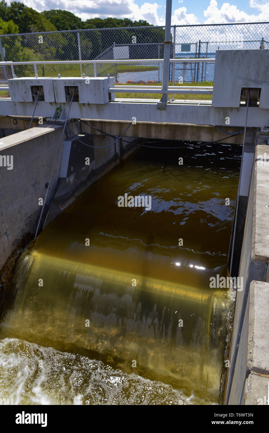 Lake Regulation Environmental Discharge Water Level Management Flowing Falling Freely Tilting Weir Gate Concrete Spillway at Flood Control Structure Stock Photo