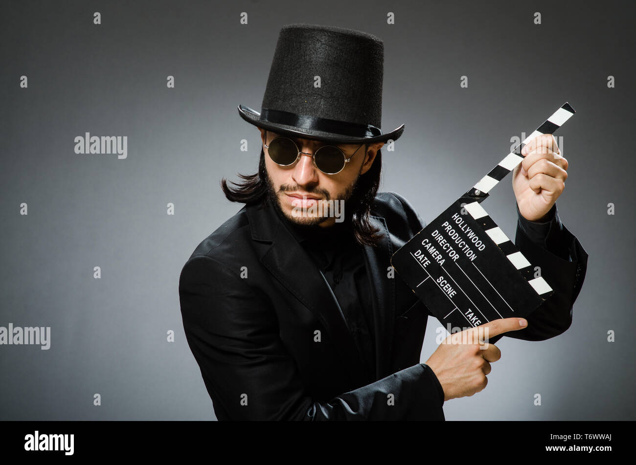 Vintage concept with man wearing black top hat Stock Photo - Alamy