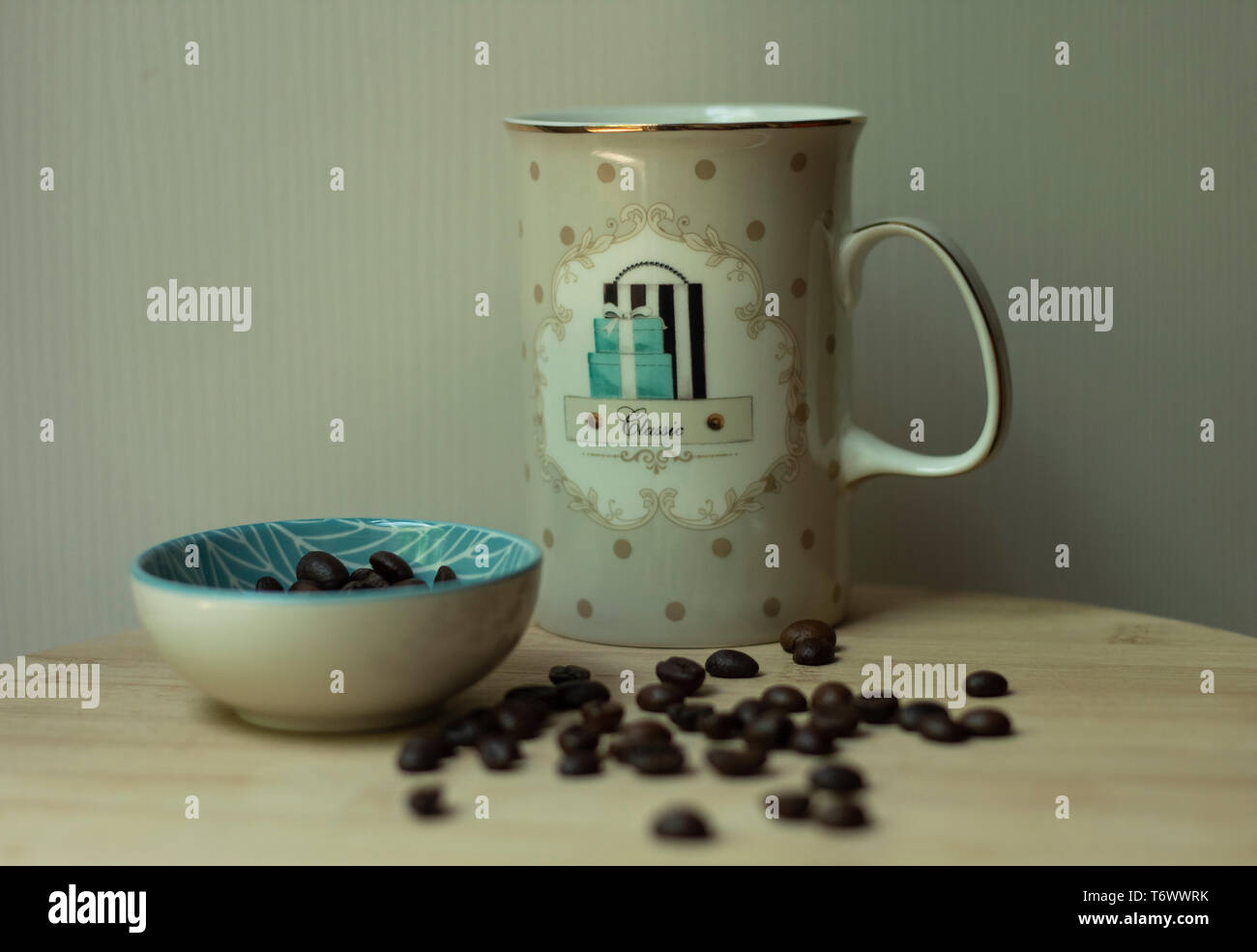 Coffee mug with some coffee beans Stock Photo