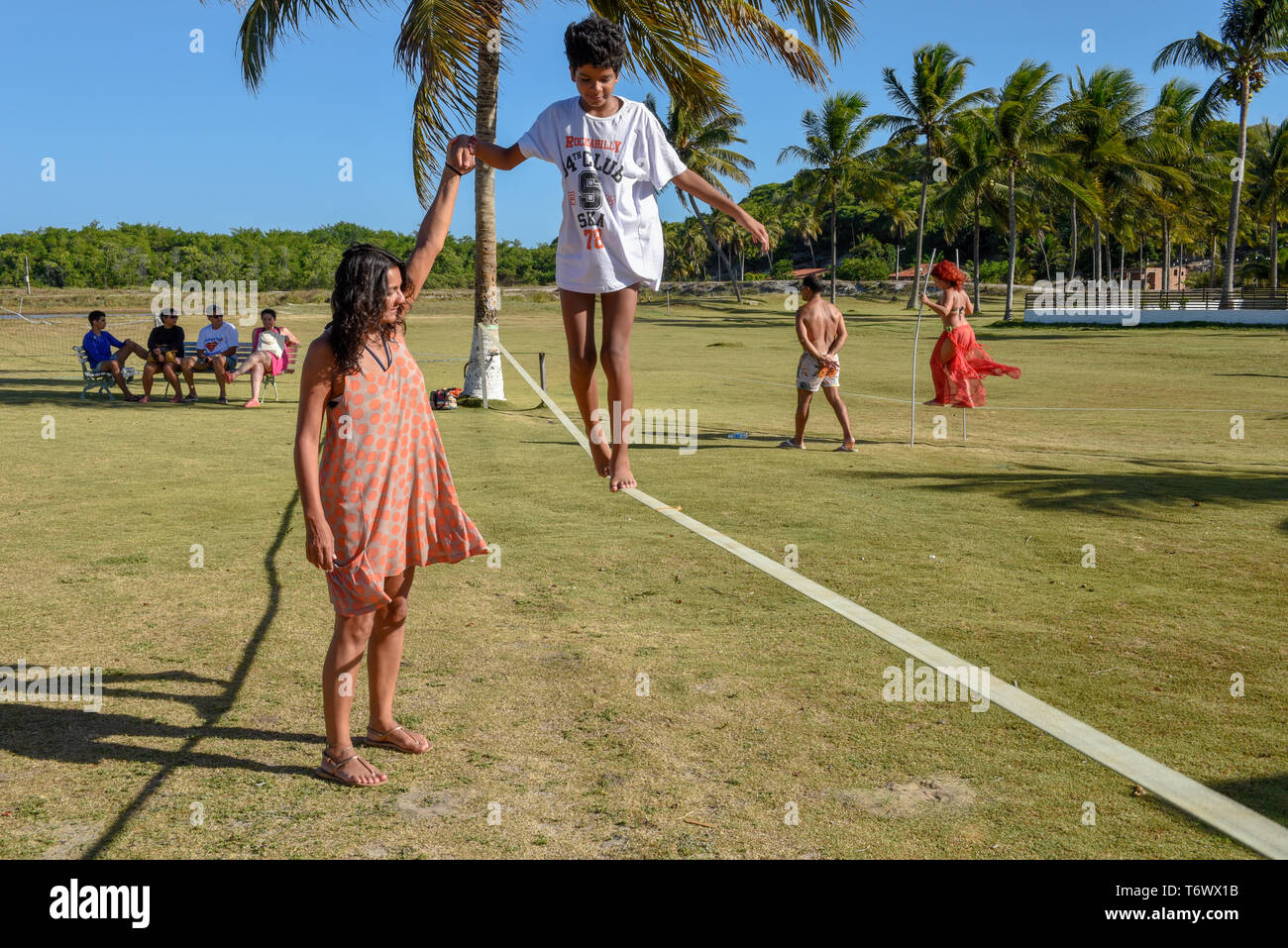 Pipa, Brazil - 23 January 2019: Woman on tightrope walker training near Pipa on Brazil Stock Photo