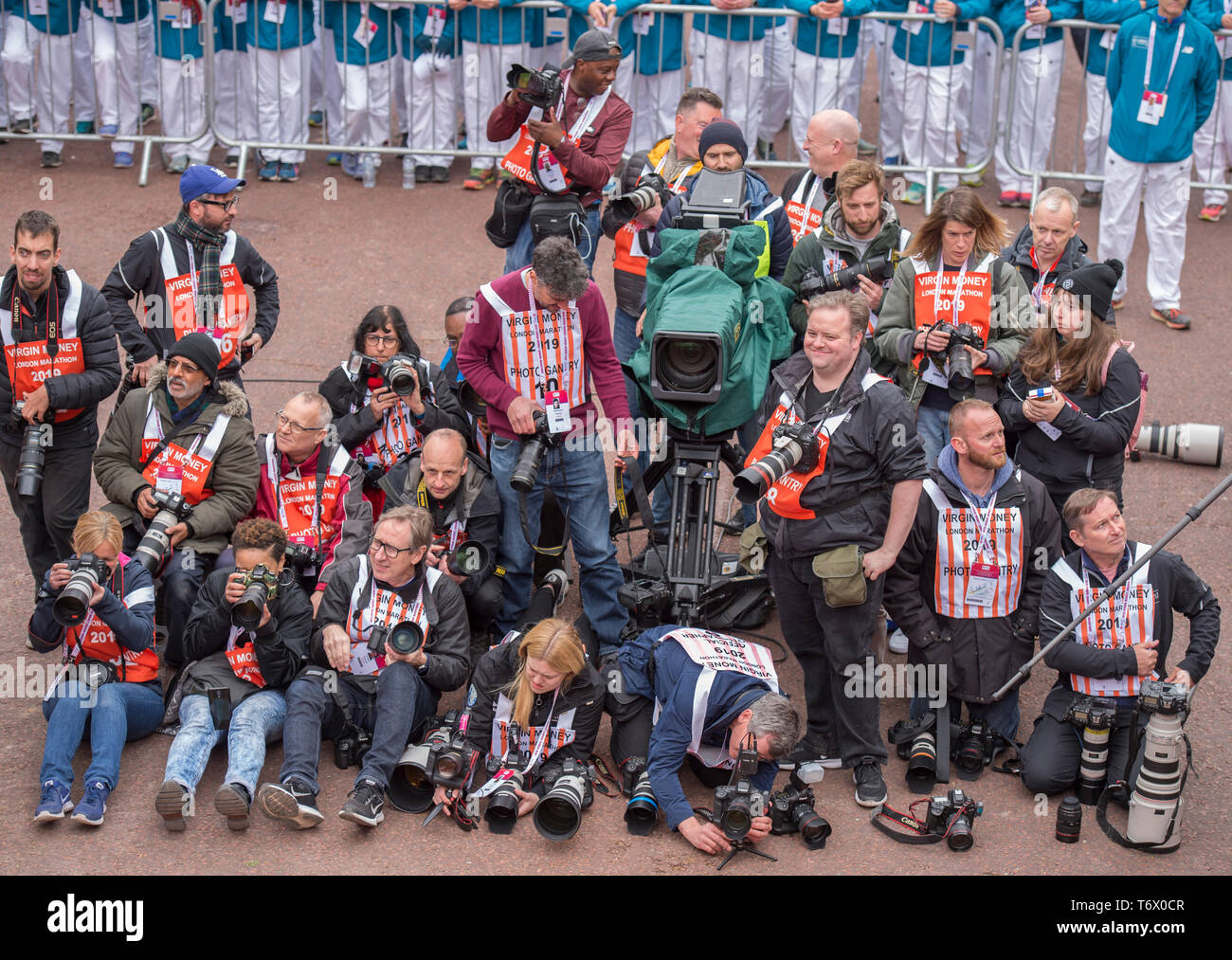 London, UK. 28th April, 2019. Photographers at The London Marathon race finish on The Mall in Westminster. Credit: Malcolm Park/Alamy Live News. Stock Photo