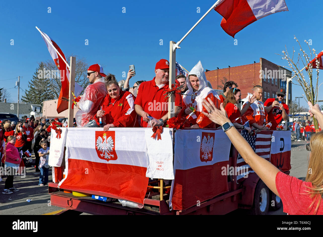The lively 2019 Dyngus Day parade makes its way through the crowds on Broadway in the Polonia district of Buffalo, New York. Stock Photo