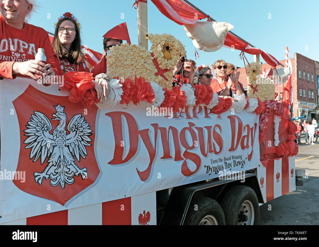 People ride on floats in the annual Dyngus Day Parade in the historic Polonia district of Buffalo, New York where revelry occurs throughout the city. Stock Photo