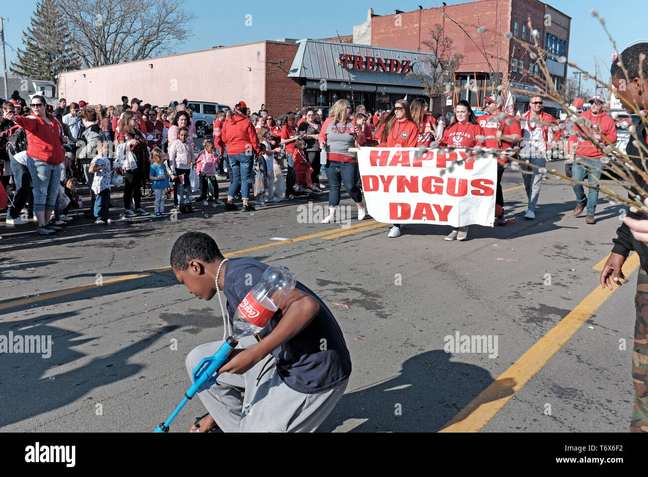 Happy Dyngus Day banner with parade participants move along Broadway in the 2019 Dyngus Day parade in Buffalo, New York, USA. Stock Photo