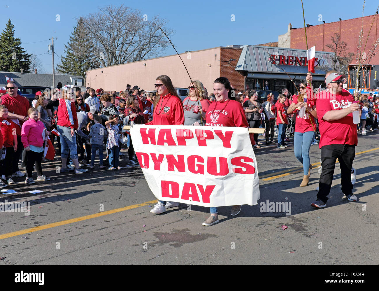Happy Dyngus Day banner with parade participants move along Broadway in the 2019 Dyngus Day parade in Buffalo, New York, USA. Stock Photo