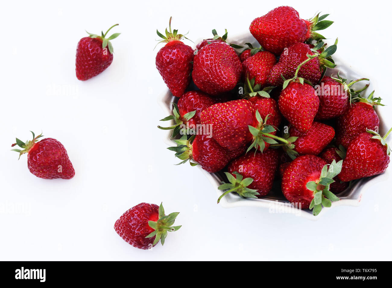 Fresh strawberries in a plate on a white background Stock Photo - Alamy