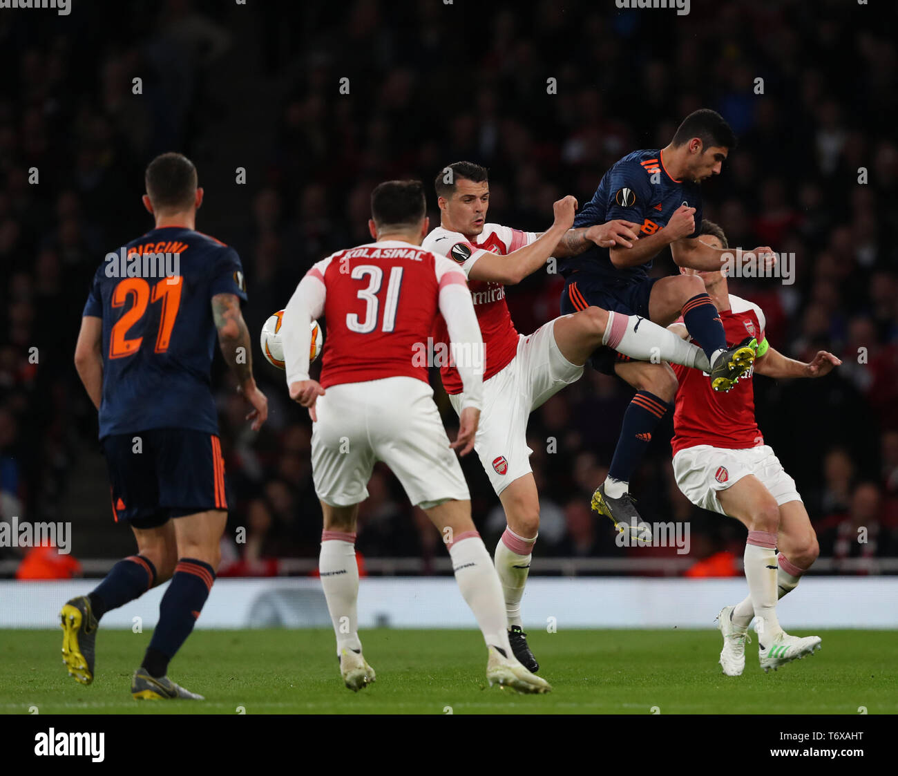London, UK. 02nd May, 2019. Granit Xhaka of Arsenal and Goncalo Guedes of Valencia compete for the ball during the Europa League semi final leg one match between Arsenal and Atletico Madrid at The Emirates Stadium on May 2, 2019 in London, United Kingdom. Credit: Mitchell Gunn/ESPA-Images Credit: Cal Sport Media/Alamy Live News Stock Photo