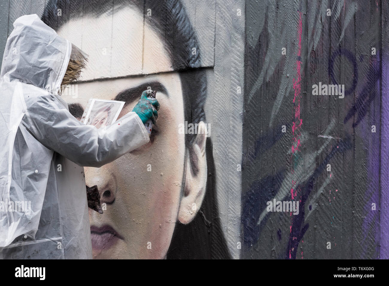 Stevenson Square, Manchester, UK. 3rd May, 2019. French born graffiti artist Akse p19 completes his Arya Stark mural in Manchester's Northern Quarter. Arya is a character played by Maisie Williams in the popular televsion series Game of Thrones. Credit: Howard Harrison/Alamy Live News Stock Photo