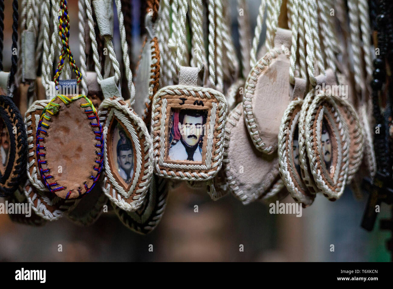 03 May 2019, Mexico, Culiacán: Pendants with a picture of Jesus Malverde are offered for sale. Malverde is considered the saint of drug bosses in Mexico. On the occasion of his 110th anniversary of death on 03.05.2019 numerous faithful gathered in his native town in the federal state of Sinaloa. Malverde, who is not recognized as a saint by the Catholic Church, is said to have been a highwayman during his lifetime. Many Mexicans worship him as a kind of Robin Hood. According to oral tradition, he robbed the rich families in the Sinaloa region and then distributed the booty among the poor. The  Stock Photo