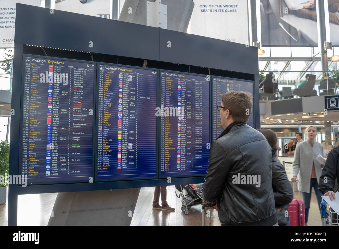 (190503) -- STOCKHOLM, May 3, 2019 (Xinhua) -- Passengers check flights' information at Stockholm Arlanda Airport in Stockholm, Sweden, on May 3, 2019. The Scandinavian Airlines (SAS) pilot strike has ended after an agreement was reached late on Thursday night. All flights in Sweden, Denmark and Norway will resume as soon as possible, Swedish News SVT reported on Friday. (Xinhua/Wei Xuechao) Stock Photo