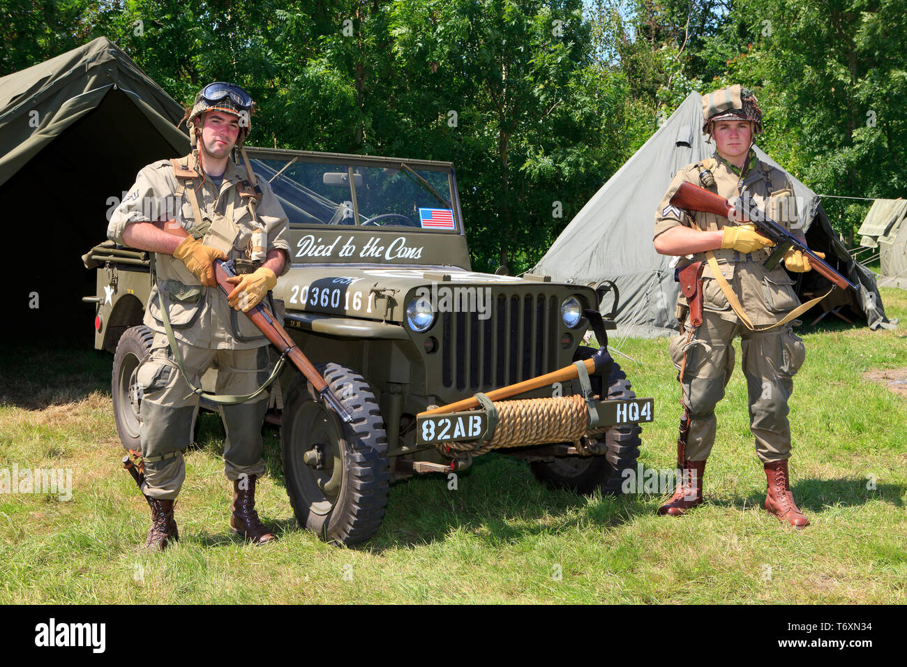2 soldiers of the 101st Airborne Division with their Willys jeep during the D-Day commemorations in Normandy, France Stock Photo