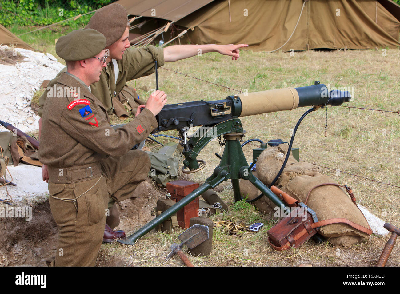 Two Royal Northumberland Fusiliers manning a Vickers .303 machine gun during the World War II D-Day celebrations in Normandy, France Stock Photo