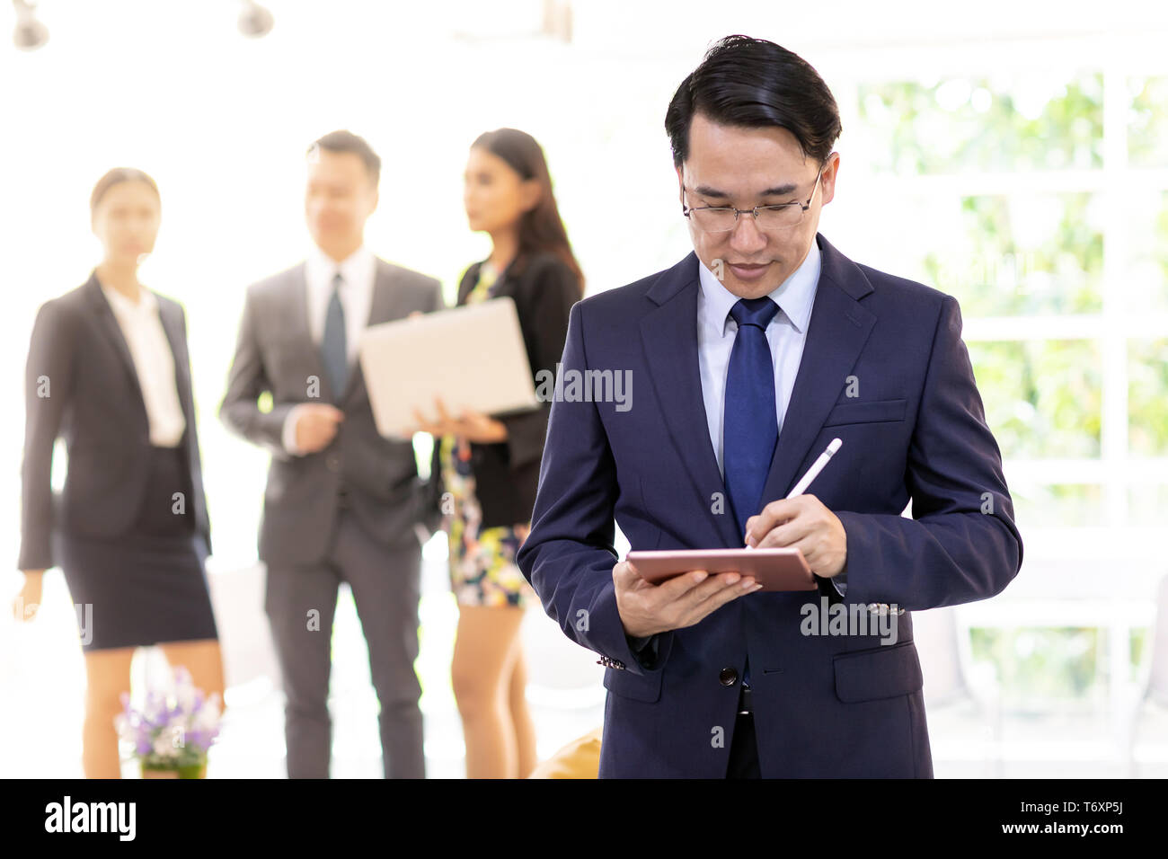 asian businessman working with team Stock Photo