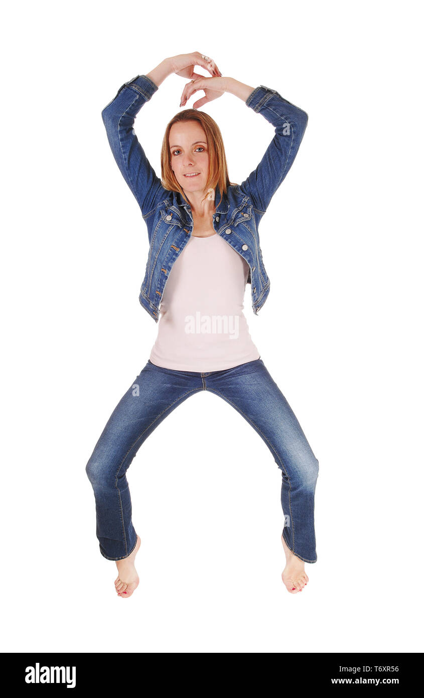 Slim woman standing in jeans tiptoe Stock Photo