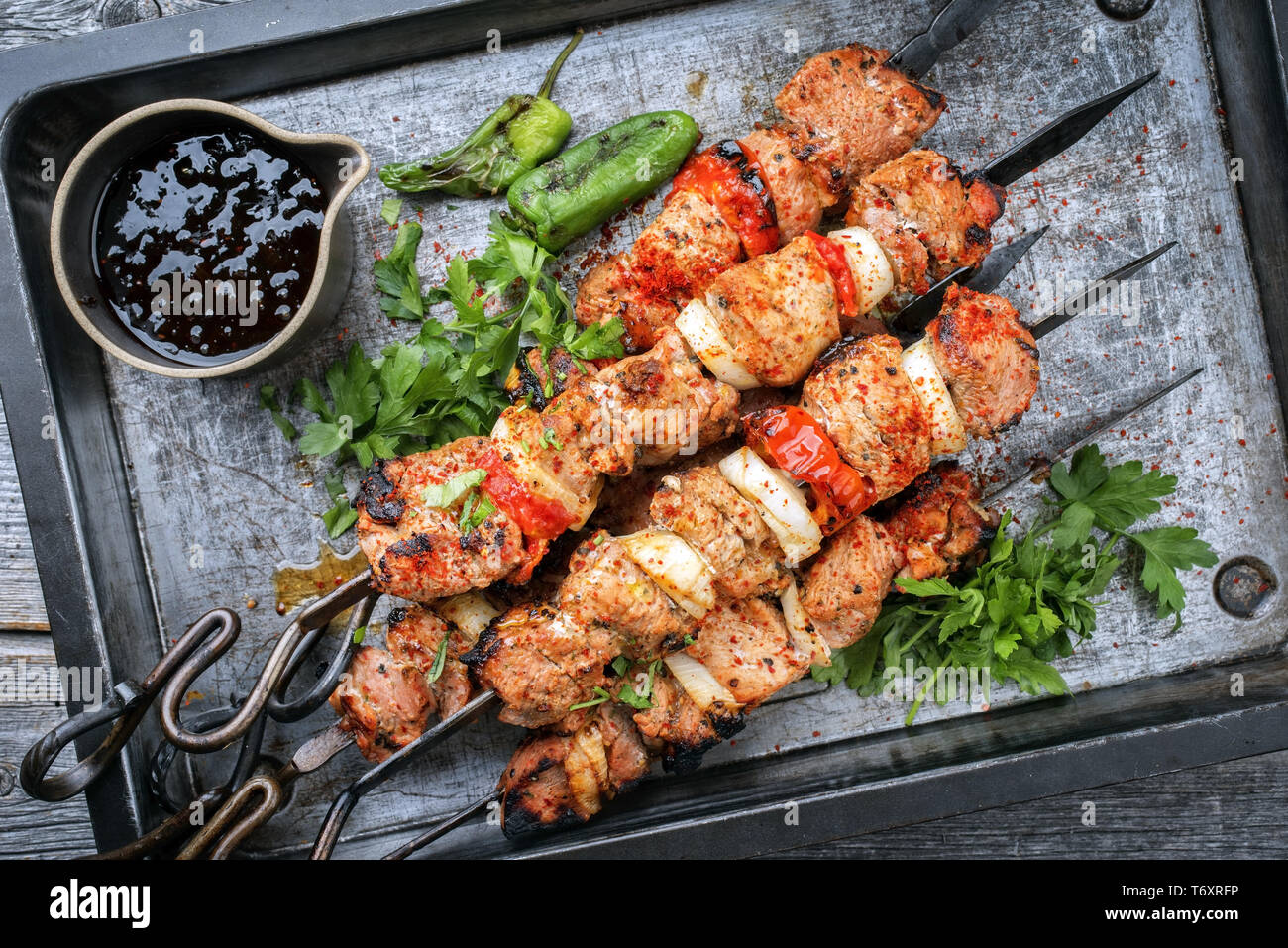 Traditional Greek souvlaki barbecue skewer with tomato Stock Photo - Alamy