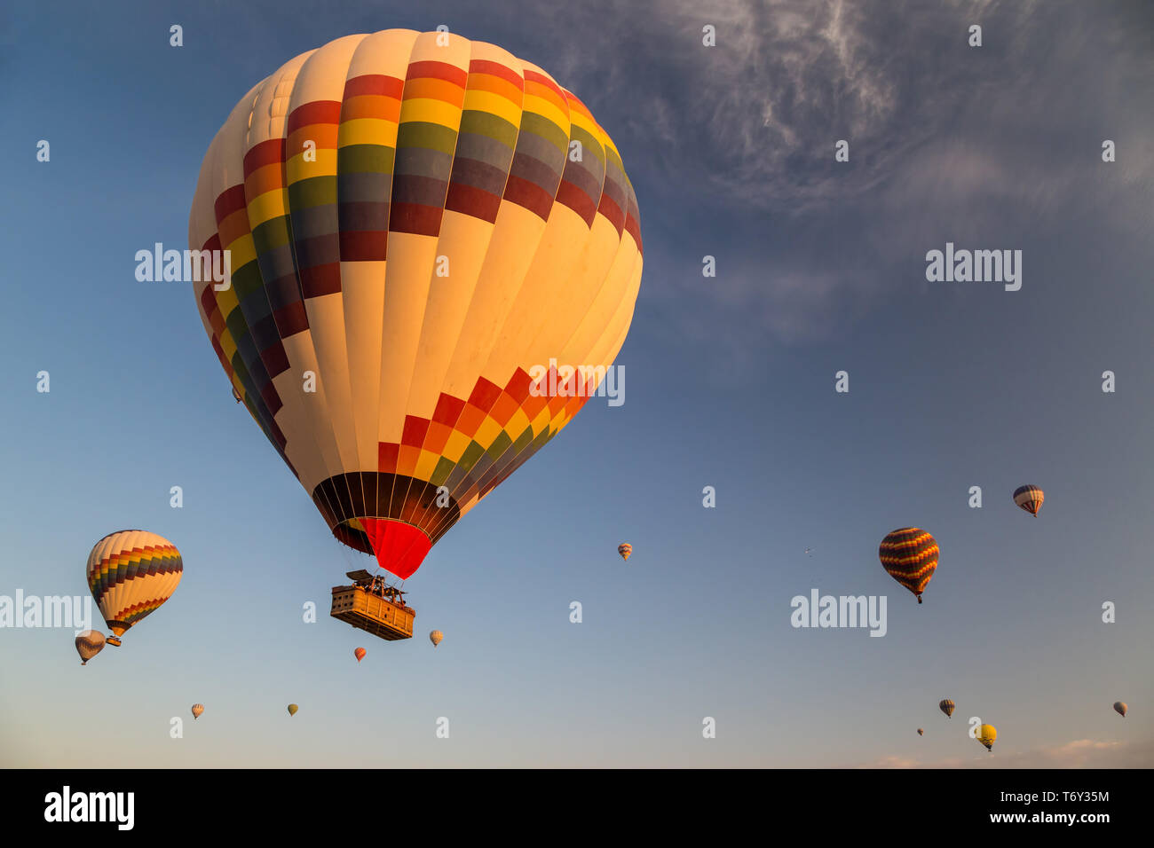 Hot air balloons flying at sunrise Stock Photo