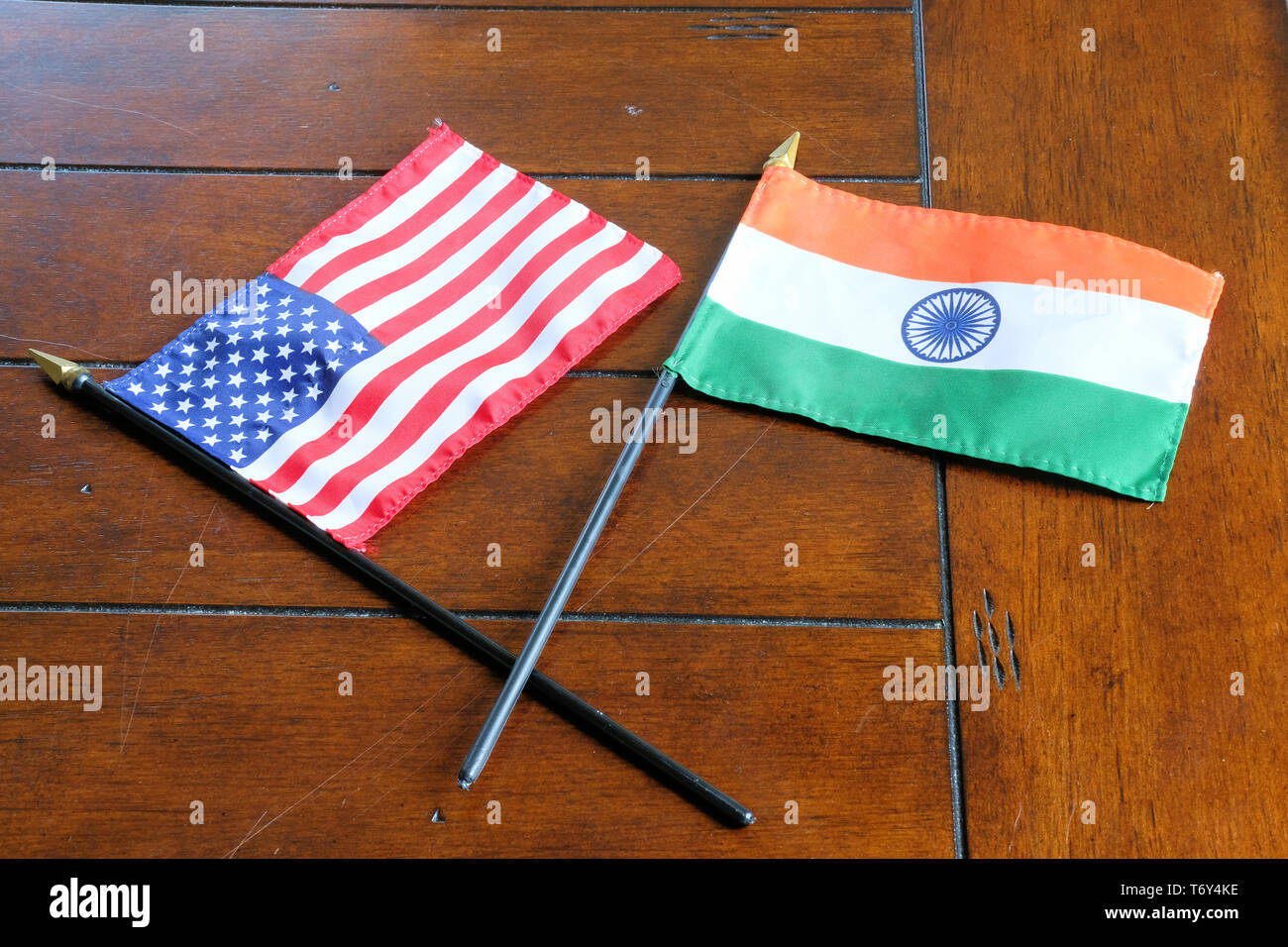 Flags of the United States and India on a wooden surface; Indian American relations. Stock Photo