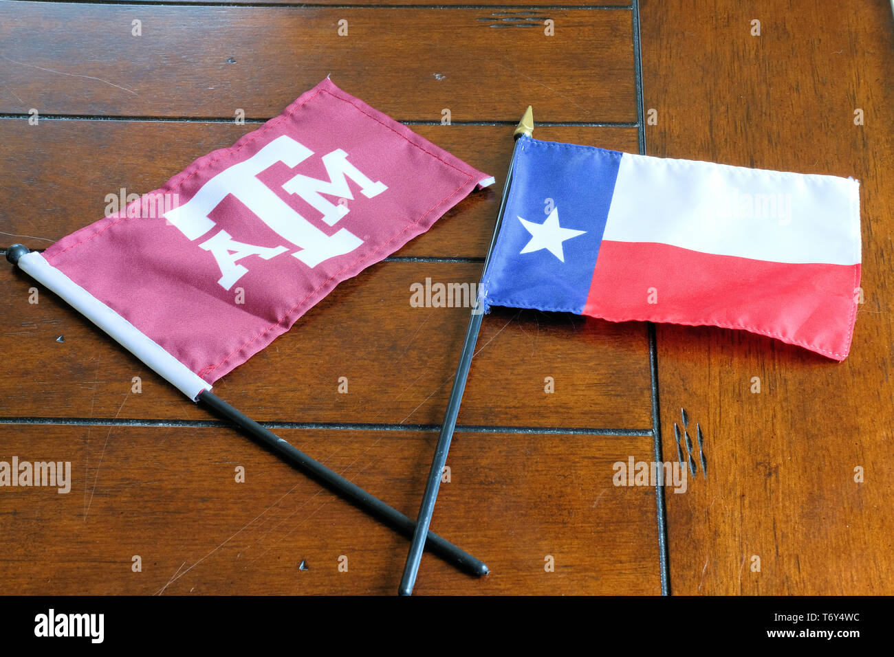 Flags of Texas and Texas A&M University; Lone Star flag and TAMU logo. Stock Photo
