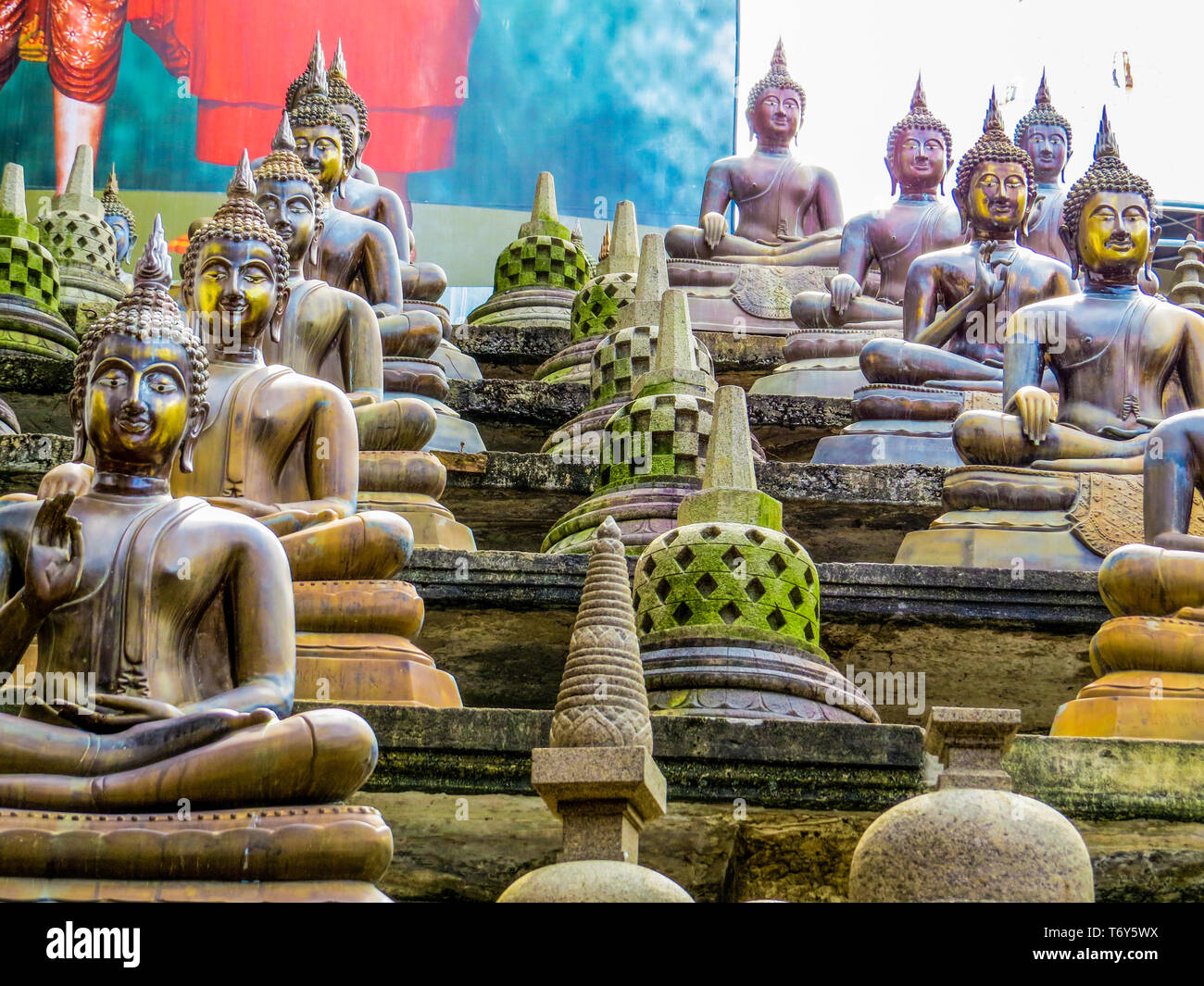 COLOMBO, SRI LANKA - DECEMBER 29, 2015: Buddha statues in Gangaramaya Buddhist Temple. Stock Photo