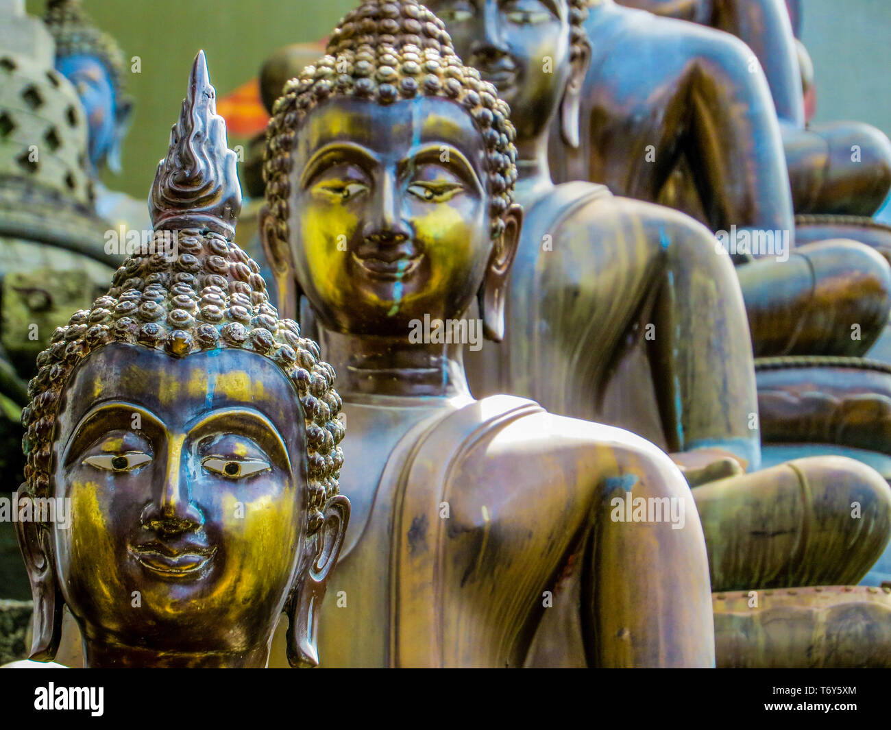 COLOMBO, SRI LANKA - DECEMBER 29, 2015: Buddha statues in Gangaramaya Buddhist Temple. Stock Photo