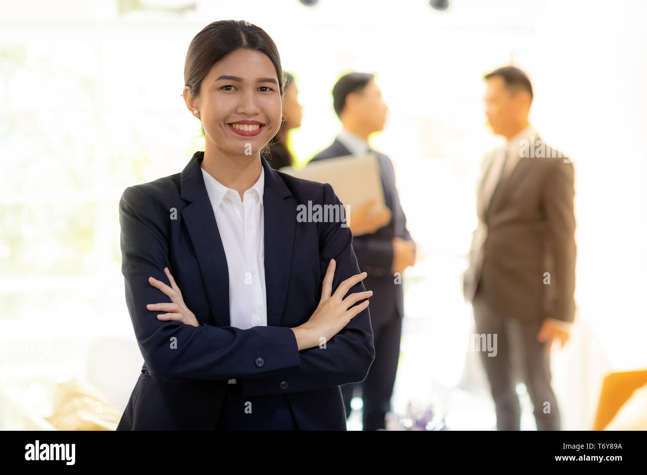 asian businesswoman with business team Stock Photo