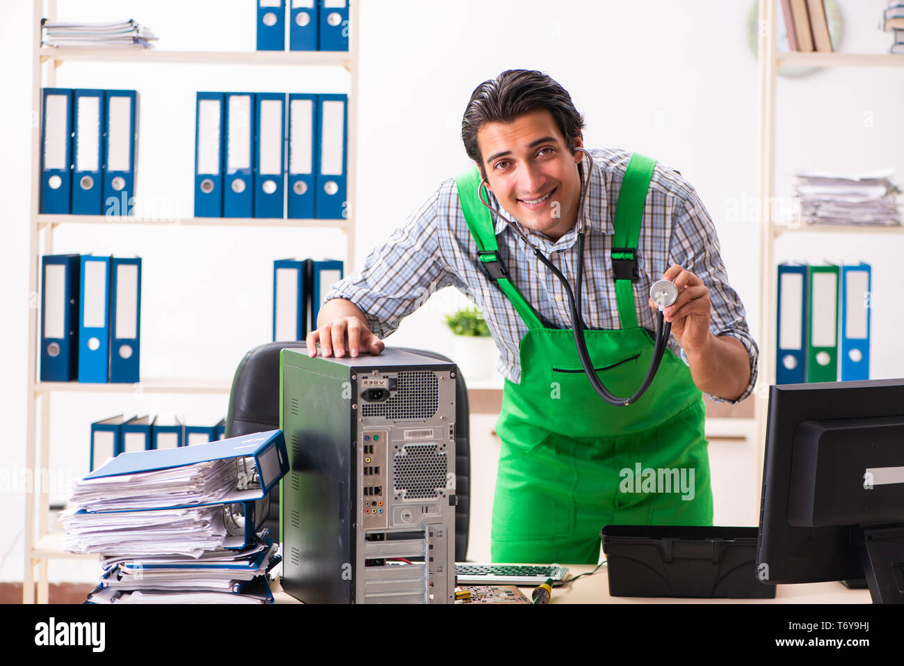 Technician Repairing A Desktop Computer High Resolution Stock ...