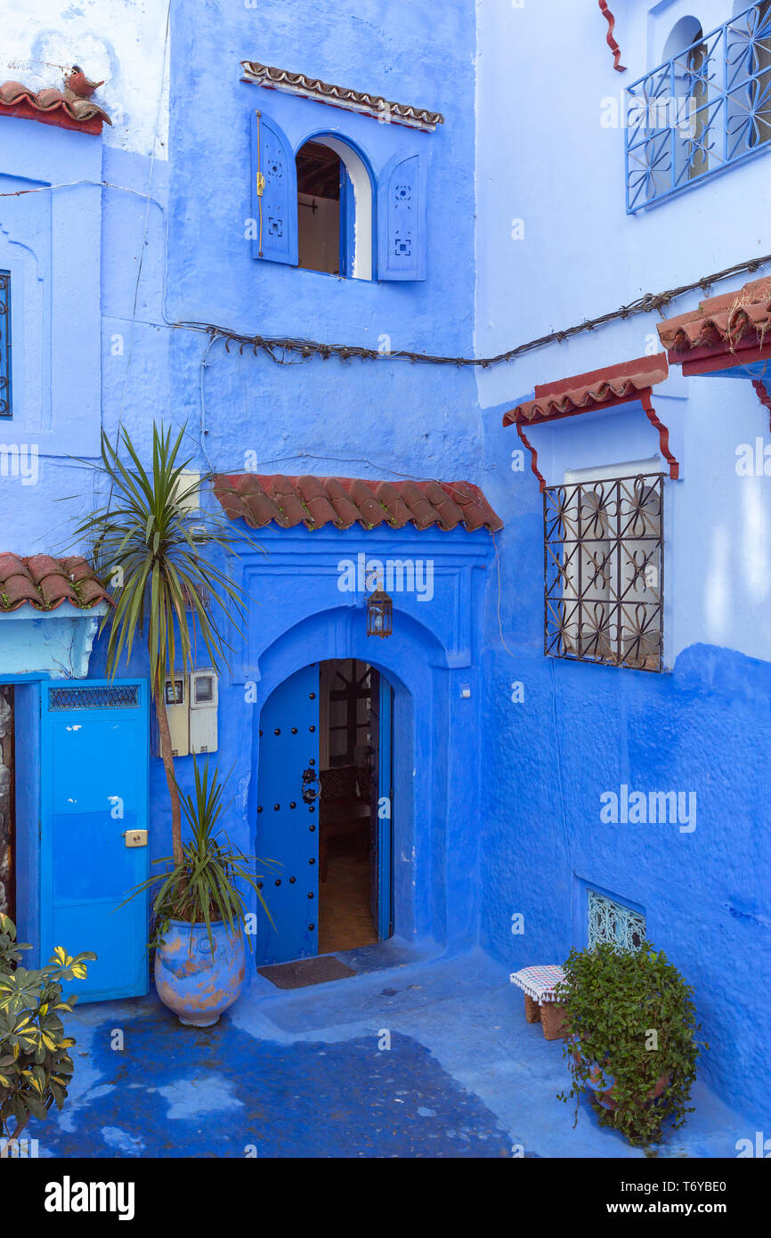 Traditional house on blue street Morocco Stock Photo