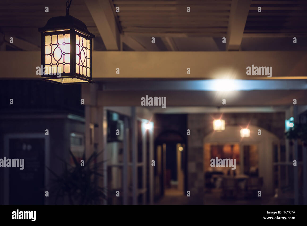 Small restaurant lit in the evening Stock Photo