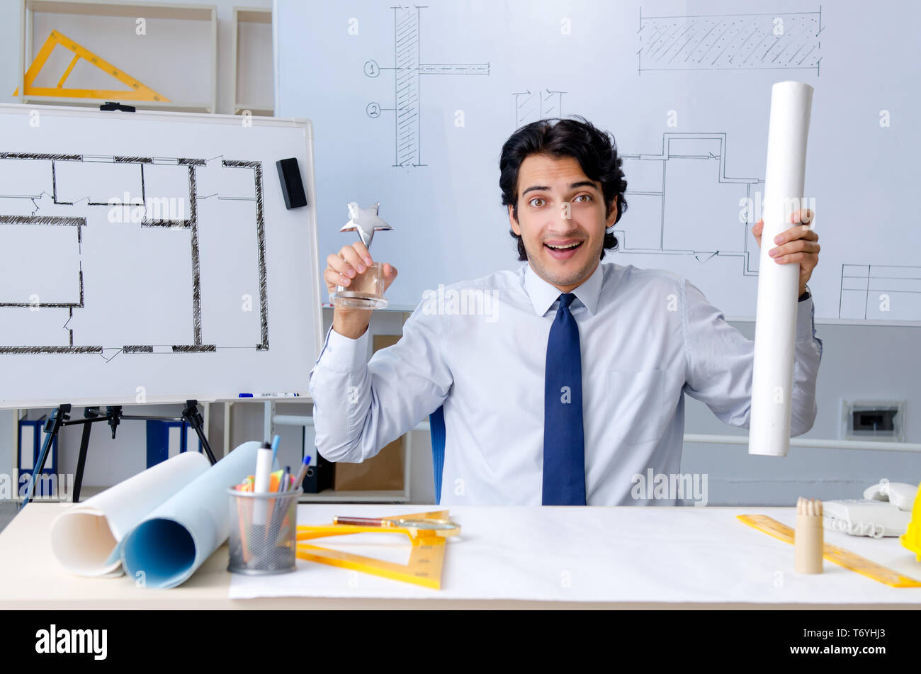 Young handsome architect working on the project Stock Photo