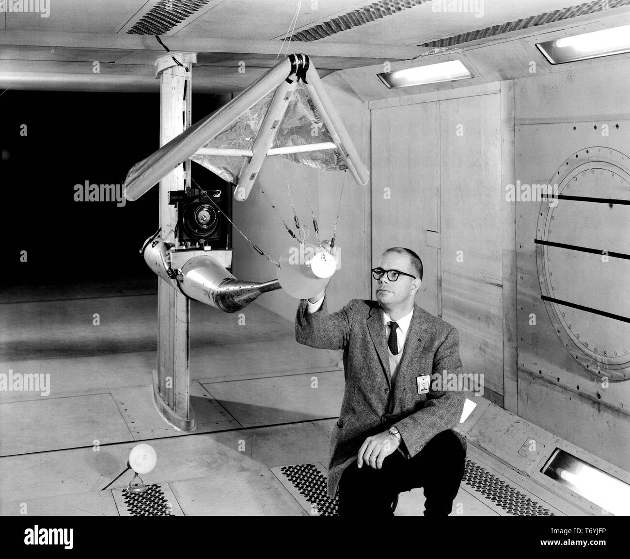 WC Sleeman, Jr inspecting a model of the 'Rogallo Wing' paraglider in wind tunnel at Langley Research Center, Hampton, Virginia, February 5, 1962. Image courtesy National Aeronautics and Space Administration (NASA). () Stock Photo