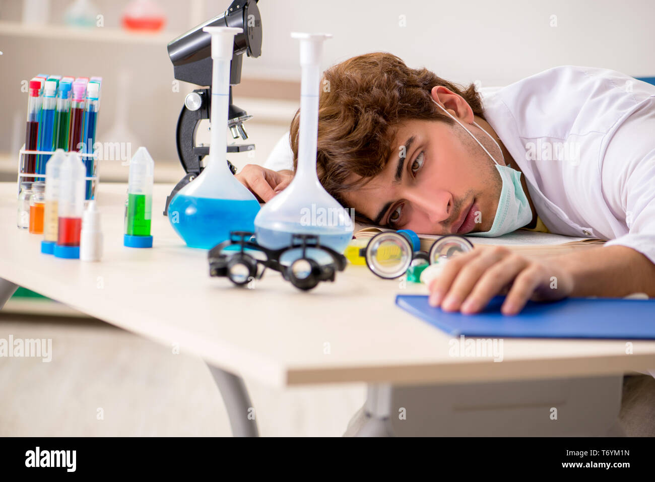 Funny crazy chemist doing experiments and tests Stock Photo