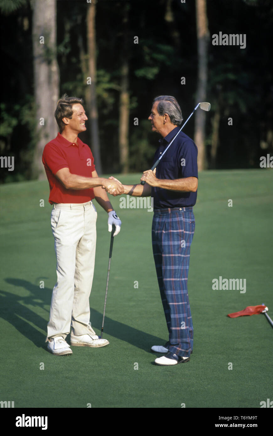 1990 HISTORICAL MEN ON SOUTHERN UNITED STATES GOLF COURSE HANDSHAKE Stock Photo