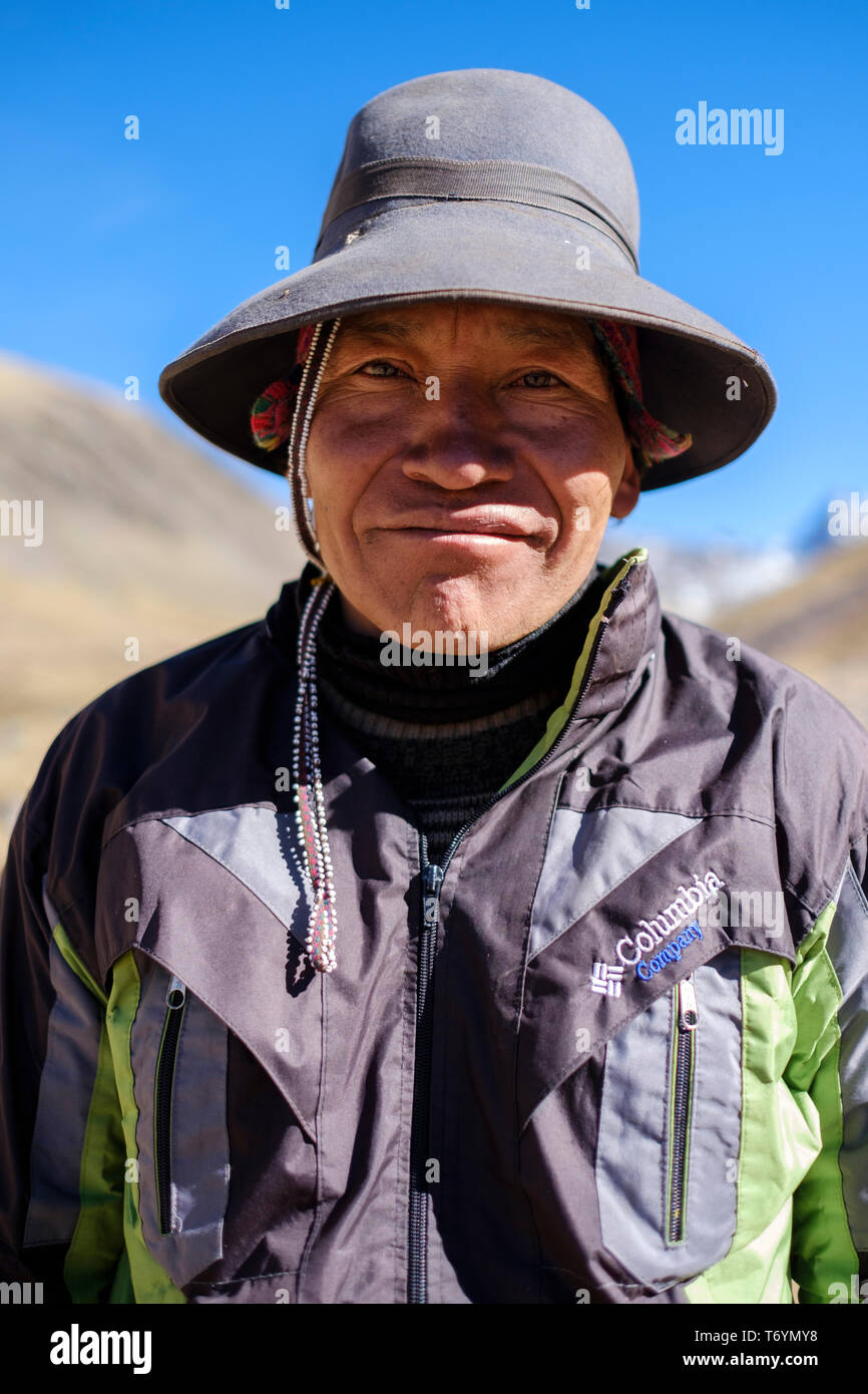 Portrait of a local Peruvian guide on the hike to the Rainbow Mountain, Los Andes, Peru Stock Photo