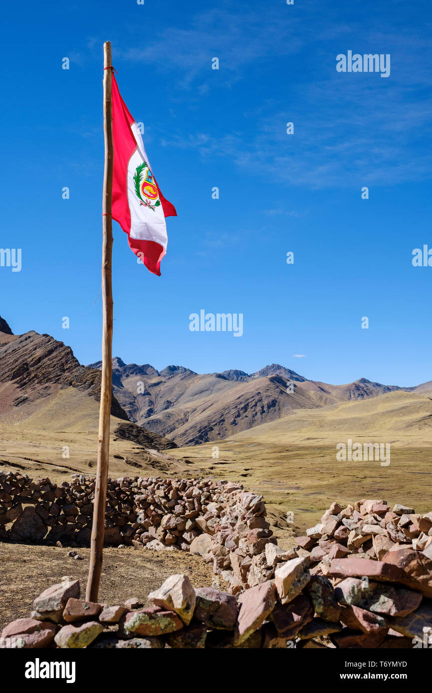 Peruvian flag on the way to the Rainbow Mountain in Los Andes, Peru Stock Photo