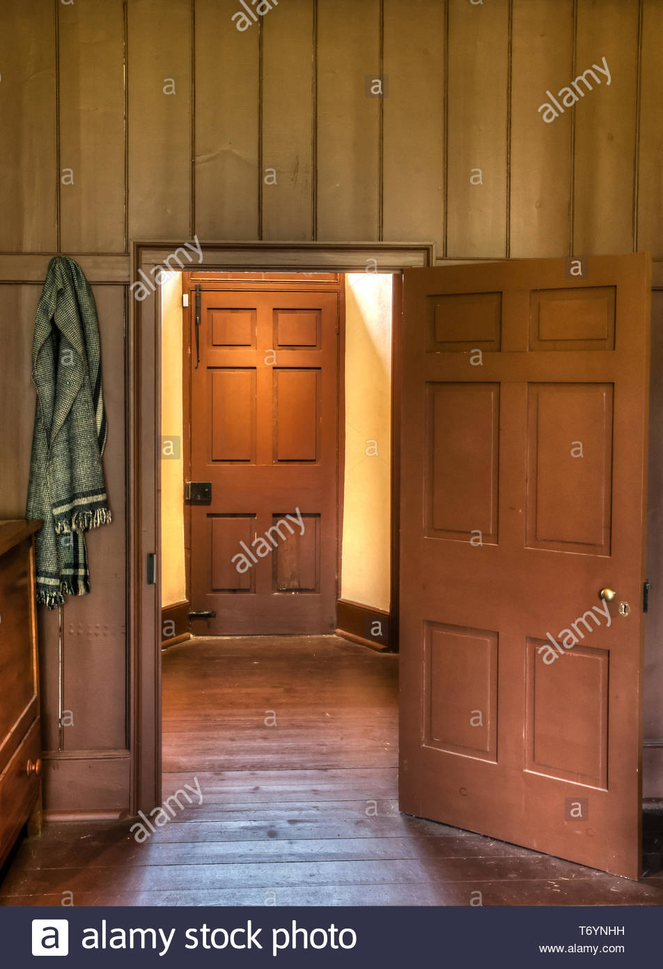 Open Doorway Into Room With Another Closed Door Stock Photo