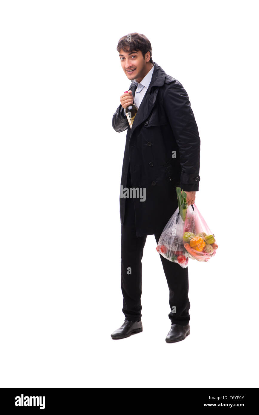 Young handsome man with vegatables in shopping concept Stock Photo