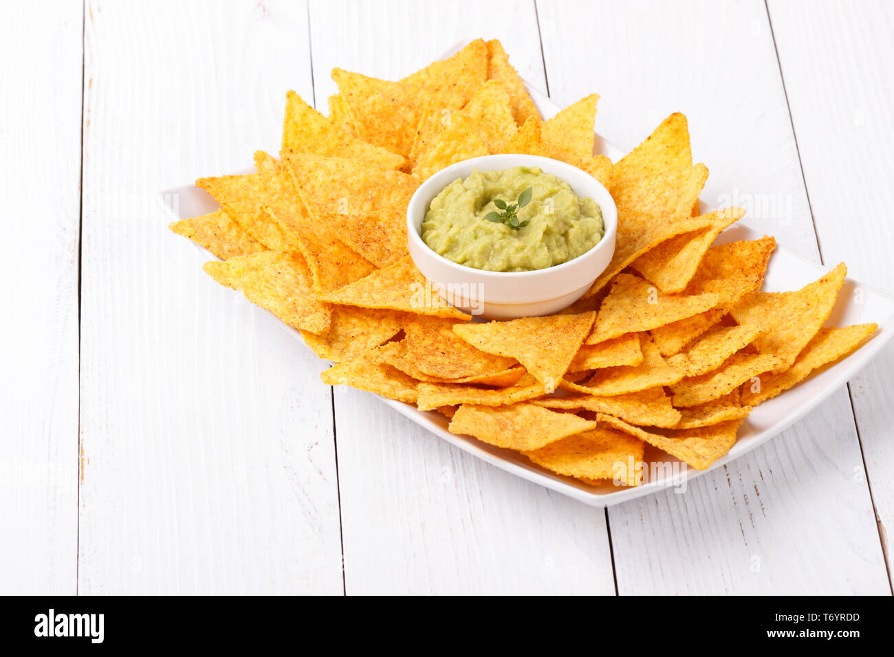 Guacamole with corn chips Stock Photo